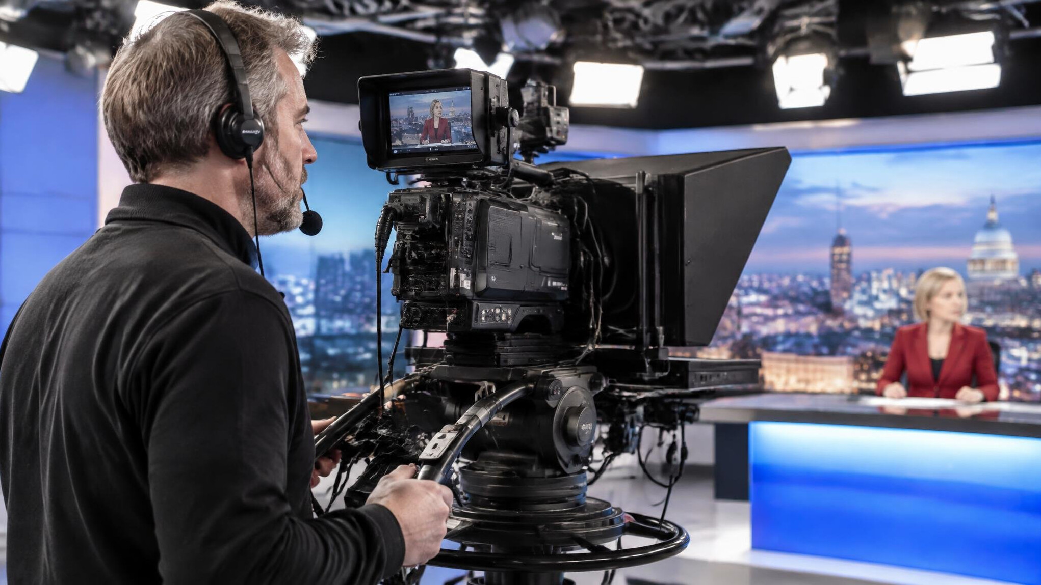 Camera operator filming a live television segment